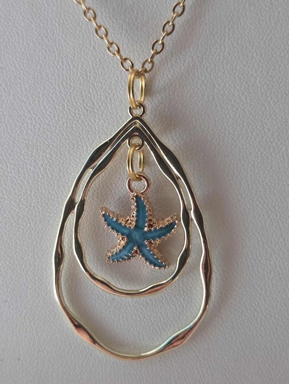 Gold Tone Teardrop Necklace with Blue Starfish Pendant